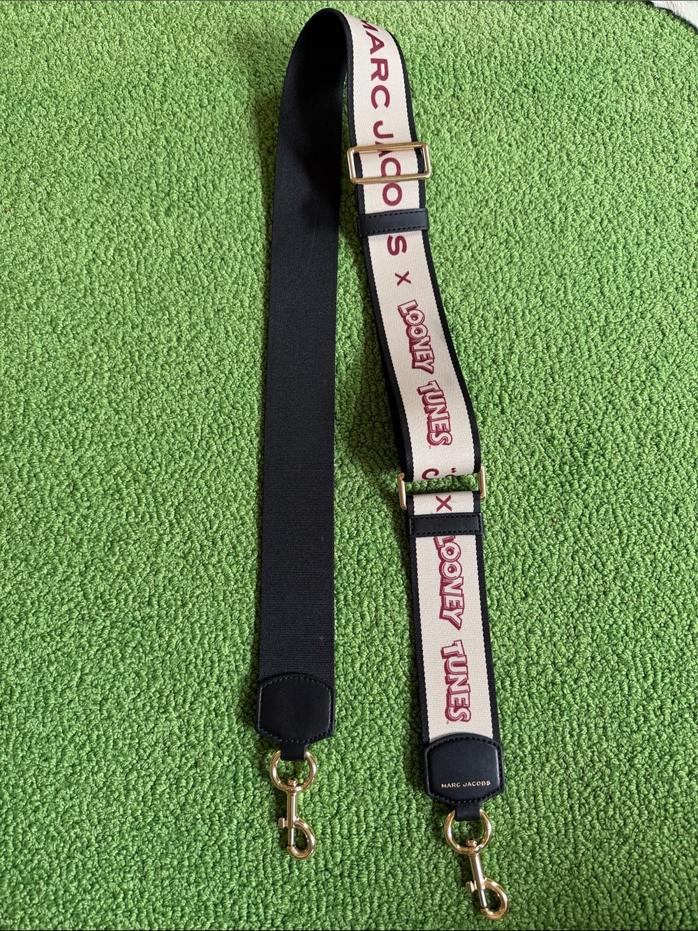 EUC Marc Jacobs x looney tunes. Cream and Black Strap with Red Looney Tunes Logo
